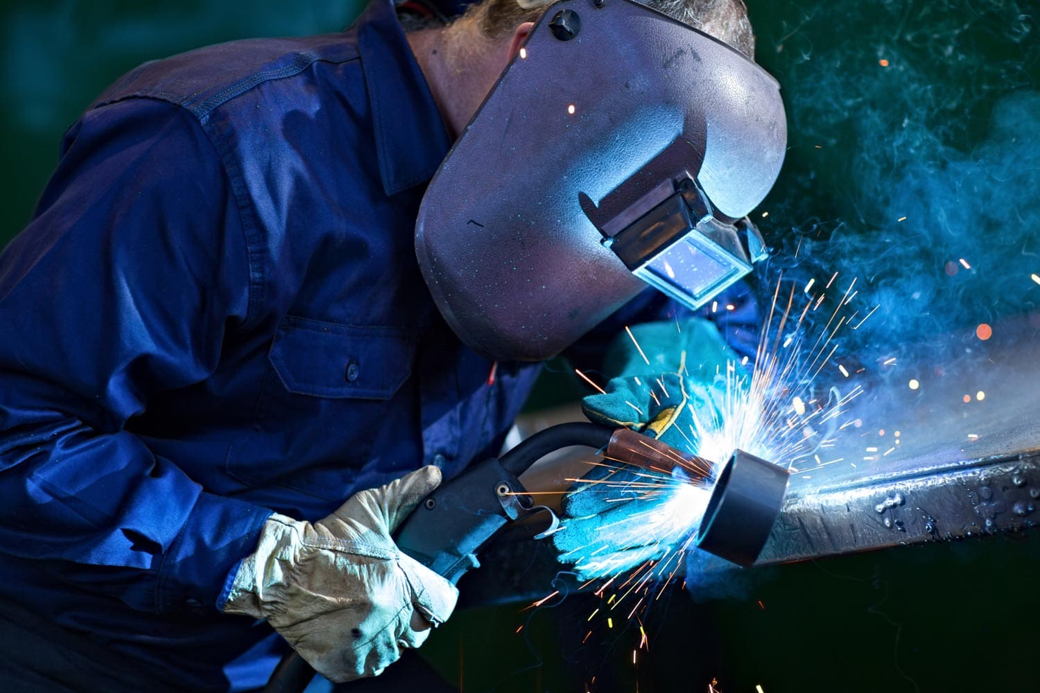 man welding and sparks flying
